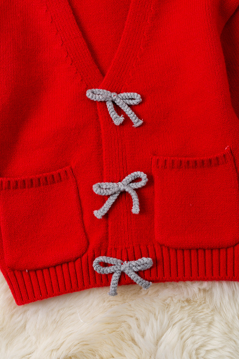 Red knit cardigan with front pockets.