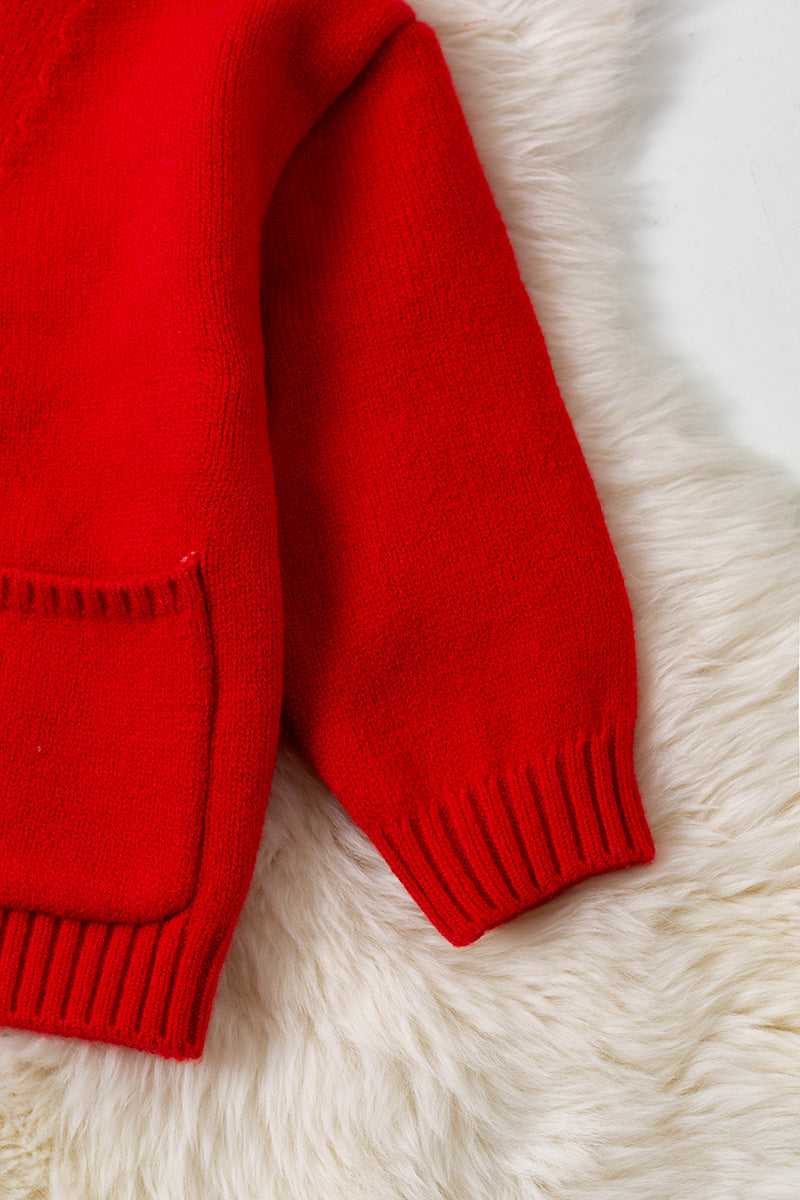 Red knit cardigan with front pockets.