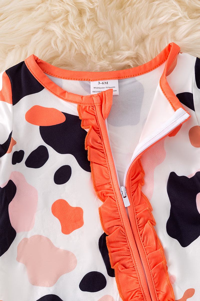 Spotted baby bodysuit with bell sleeves.