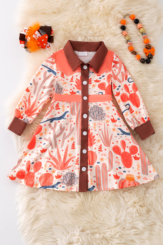 Orange western pattern printed girls dress. DRG52884