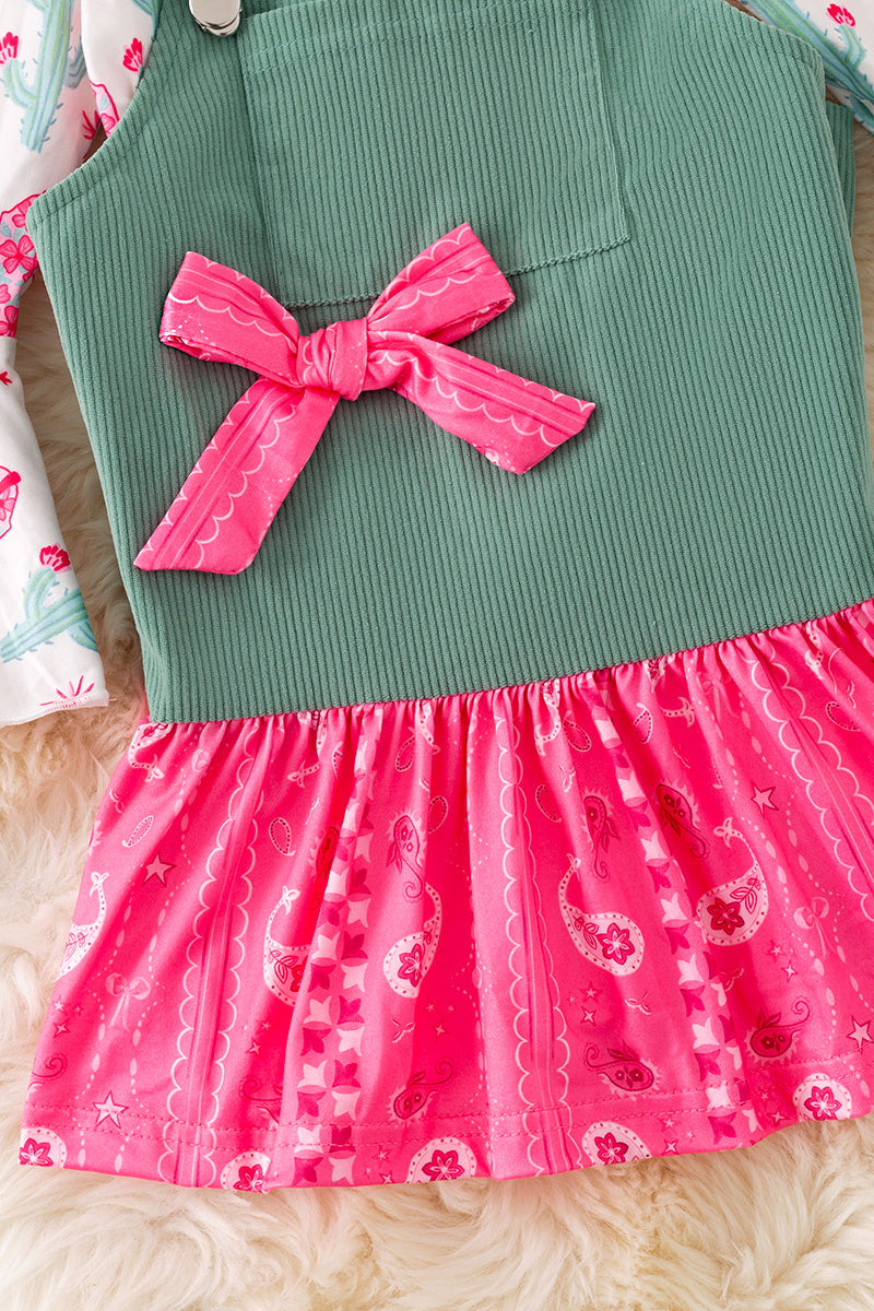 Ever Green corduroy suspender dress with Paisley hem and long sleeve shirt. (Western)