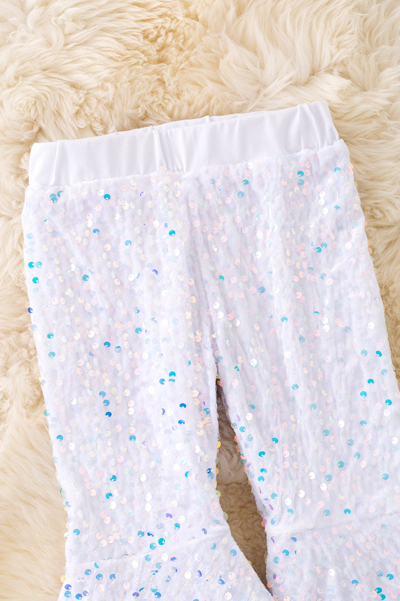 White sequins bell bottoms with fur trim. PNG50265