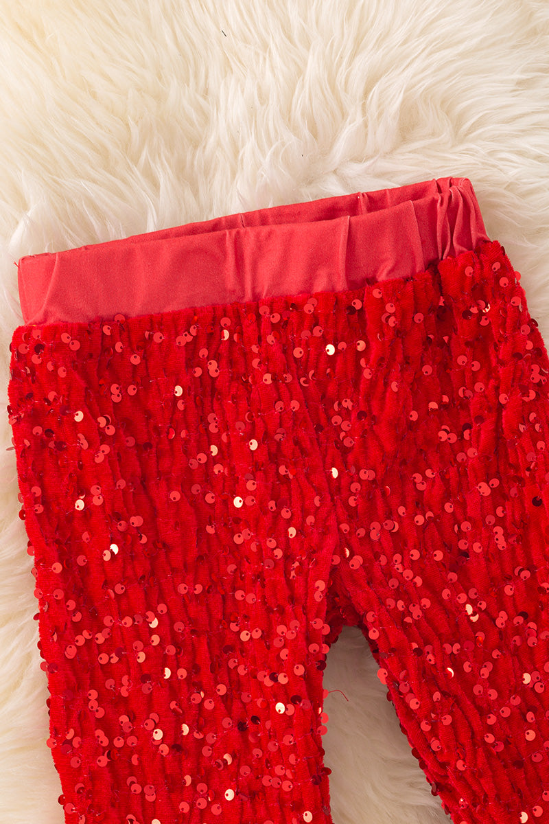 Red sequins bell bottoms with faux fur trim. PNG50267