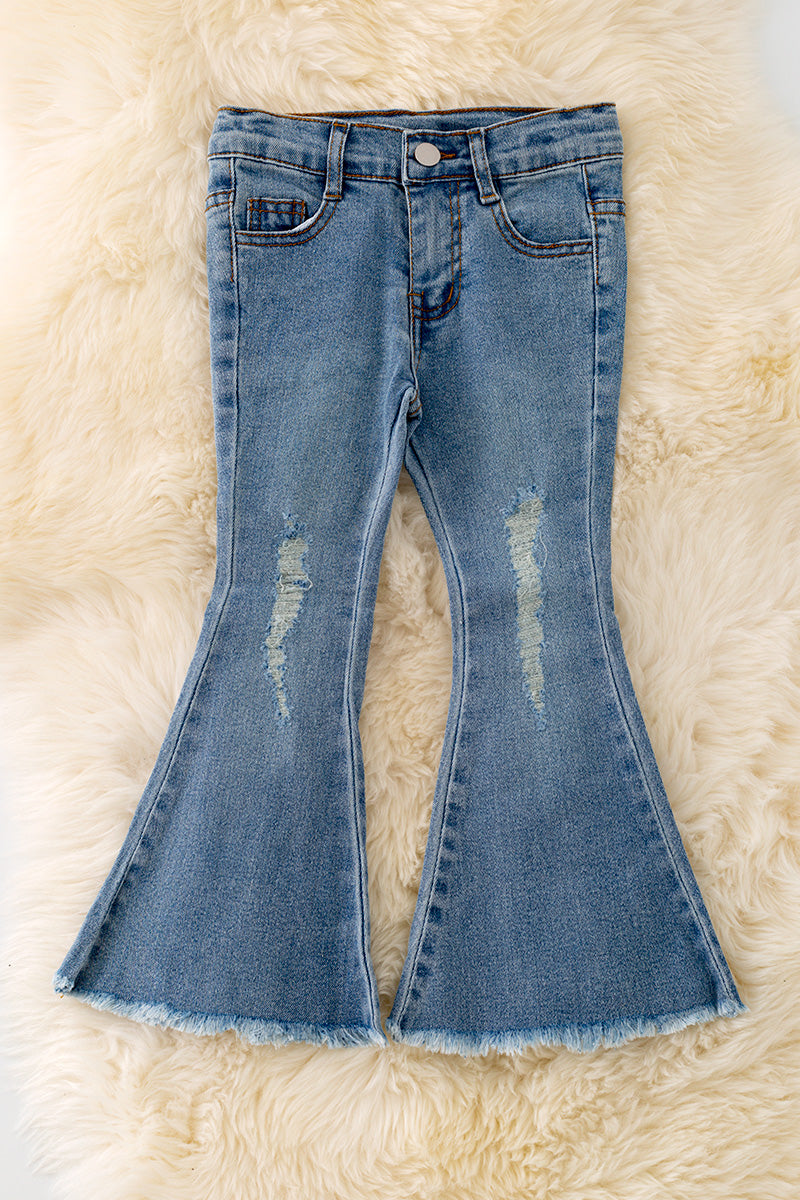 Denim blue distressed denim pants with a bootcut.