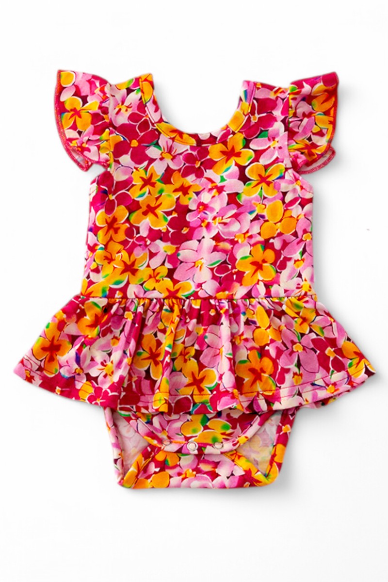 Multi-Printed girls baby onesies with snaps.