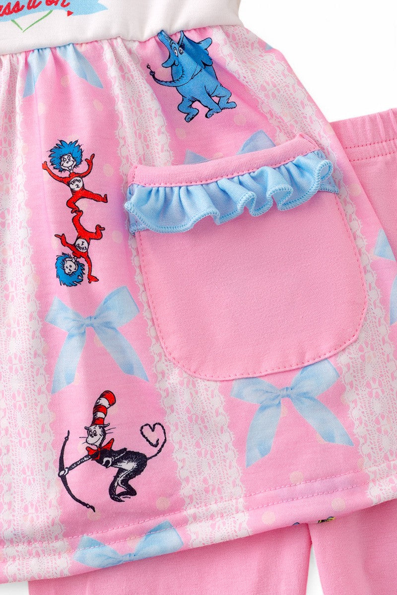 Pink character printed tunic & ruffle pants with blue bow & ruffle trim.