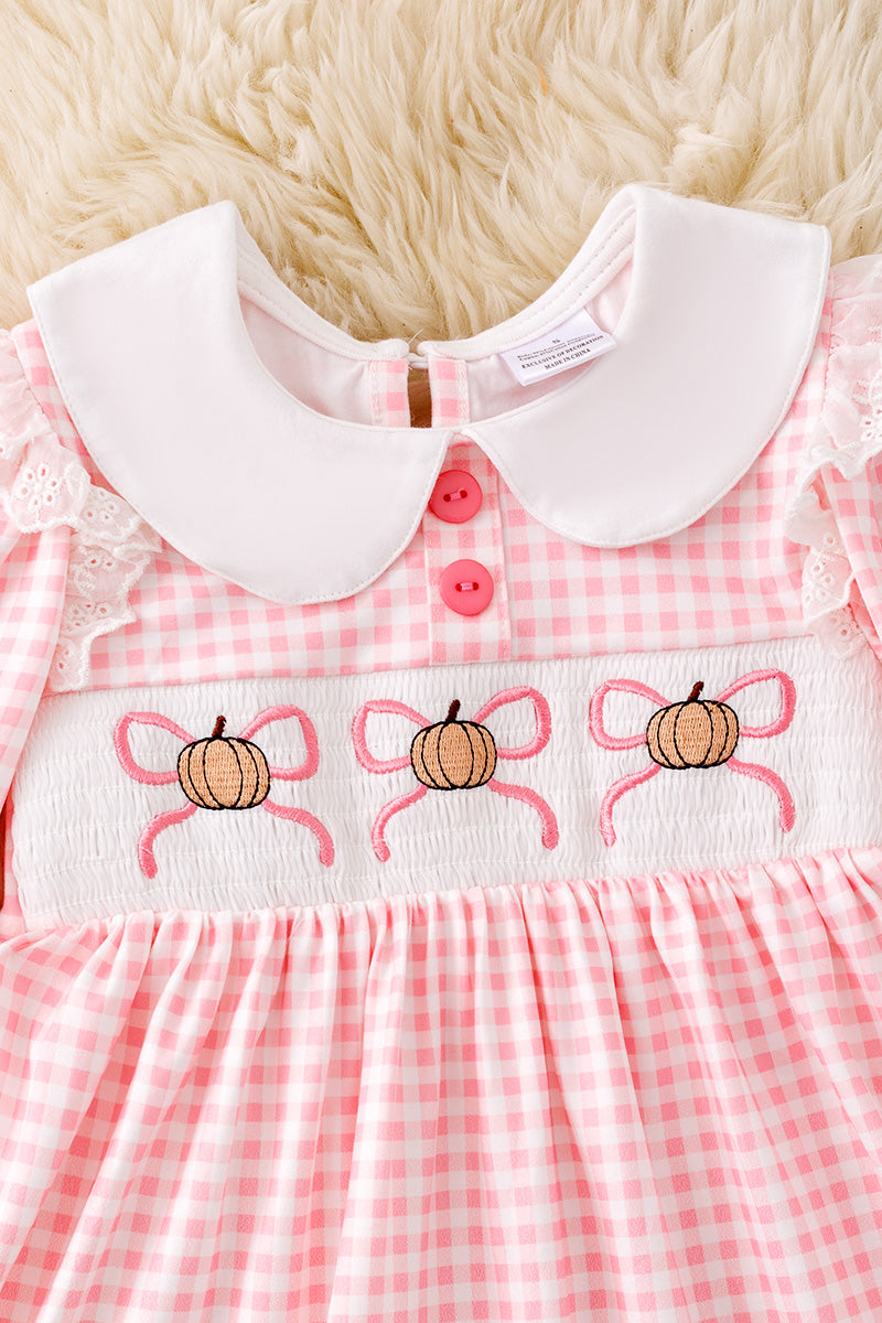 Checkered printed girls dress with pumpkin/bow embroidery. DRG53049