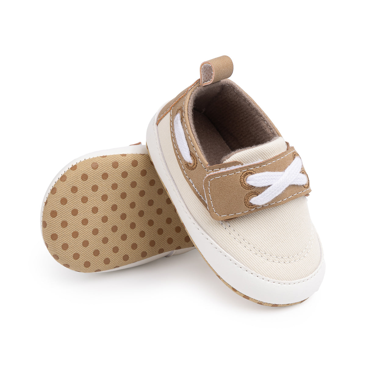Cream canvas and pleather baby shoes. CG5167