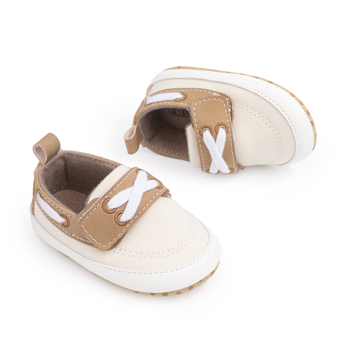Cream canvas and pleather baby shoes. CG5167