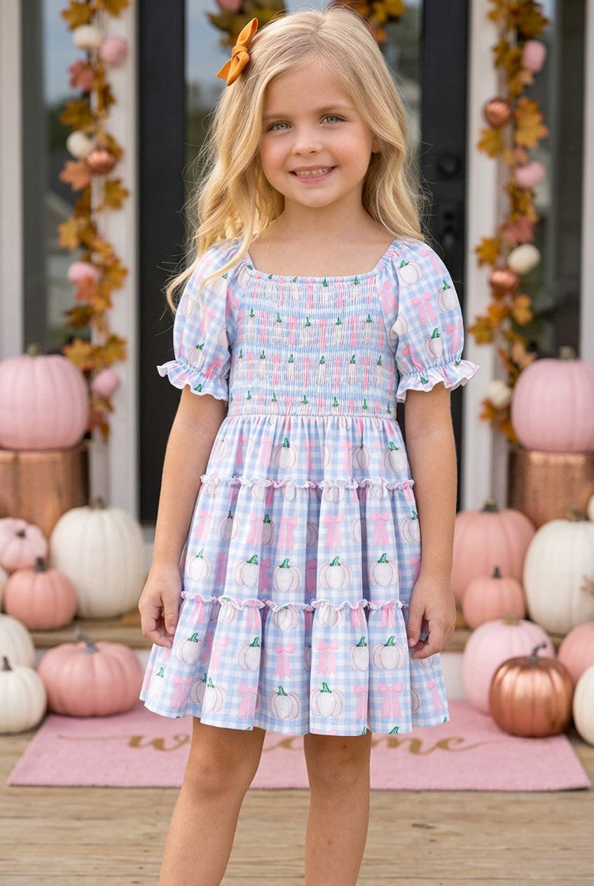 Blue gingham w/ pumpkin printed smocked tiered dress. DRG65299 SOL
