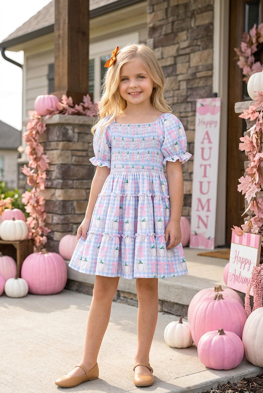 Blue gingham w/ pumpkin printed smocked tiered dress. DRG65299 SOL
