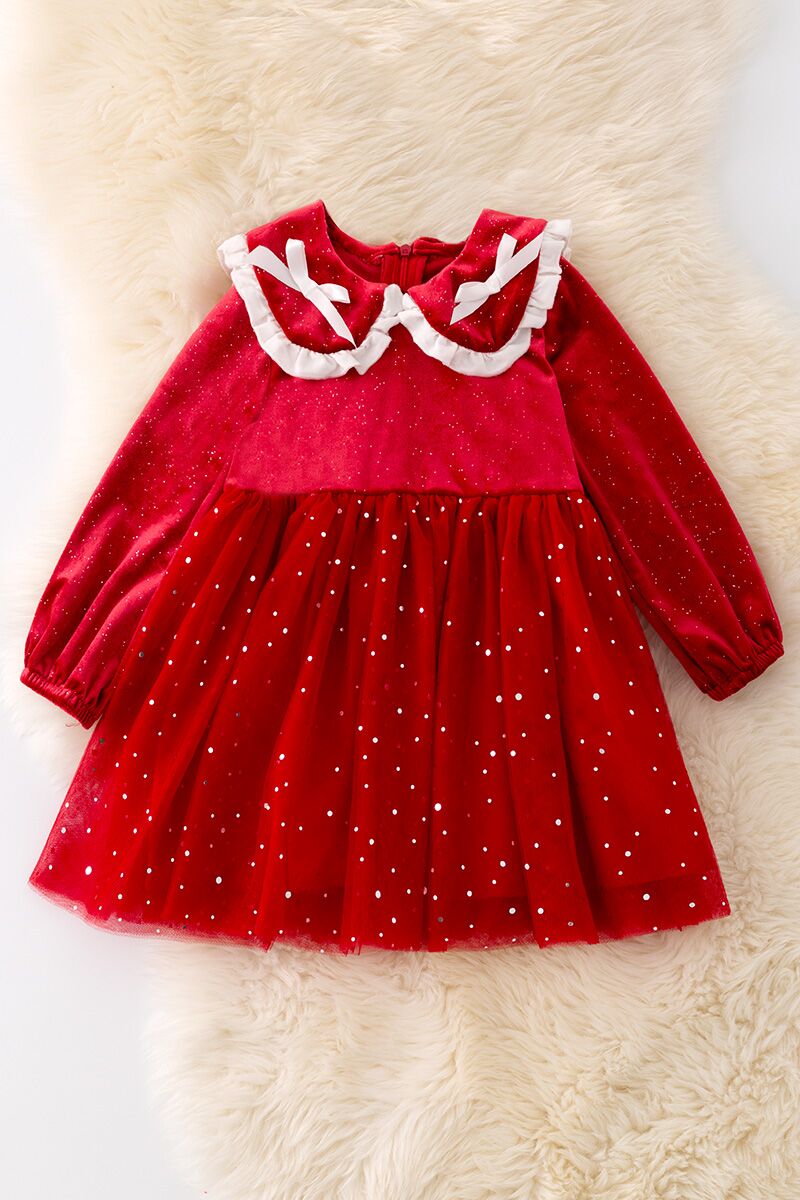 Shimmery red dress with fancy velvety fabric.
