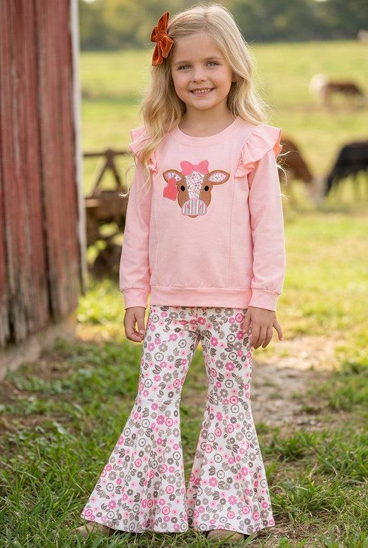 Cow applique on pink sweatshirt with floral bell bottoms. OFG61399-A