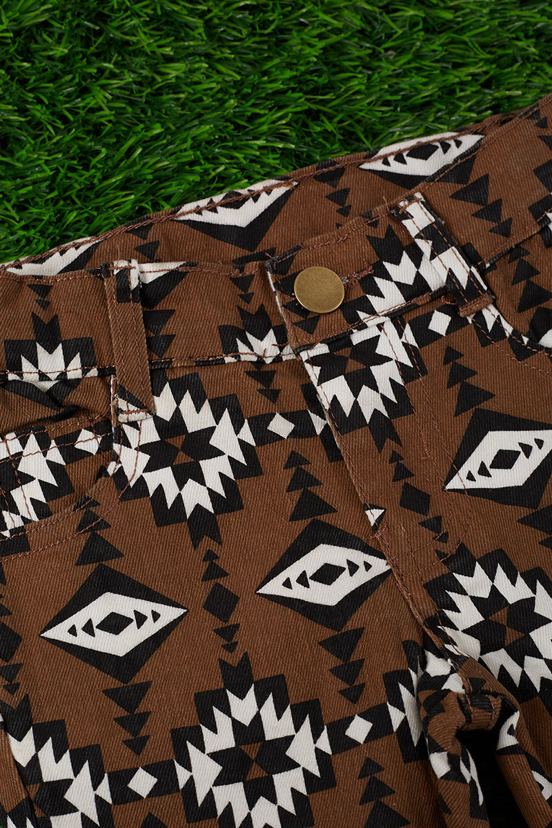 Brown aztec printed bootcut denim pants.