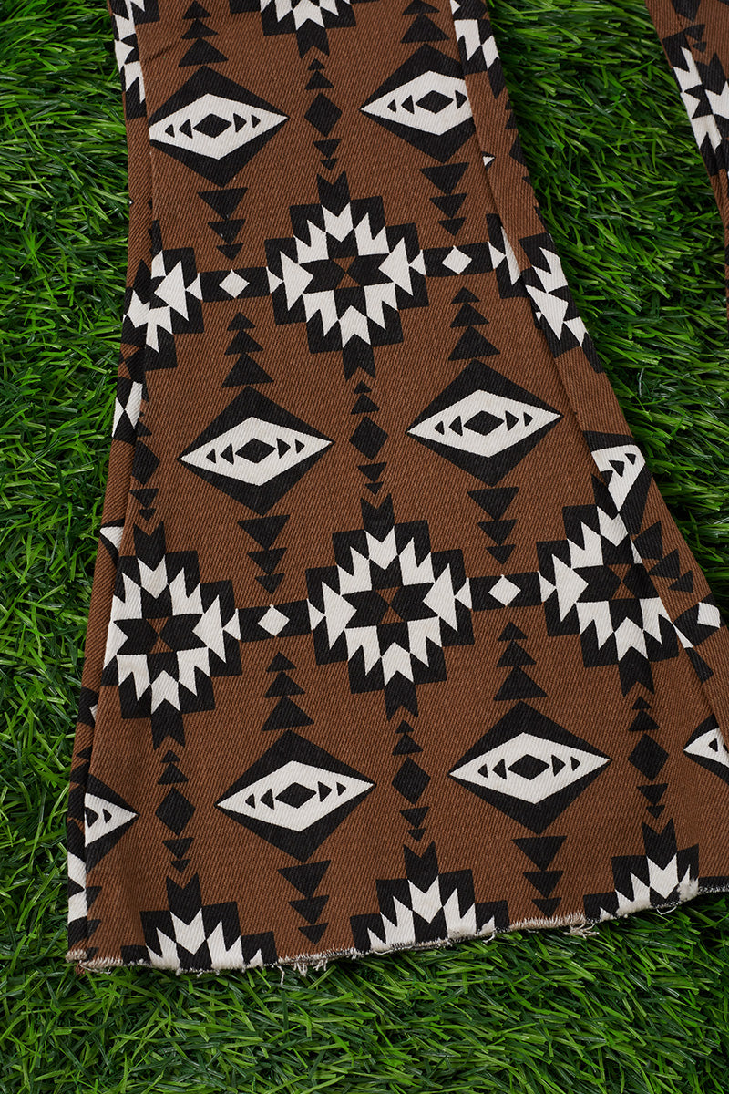 Brown aztec printed bootcut denim pants.