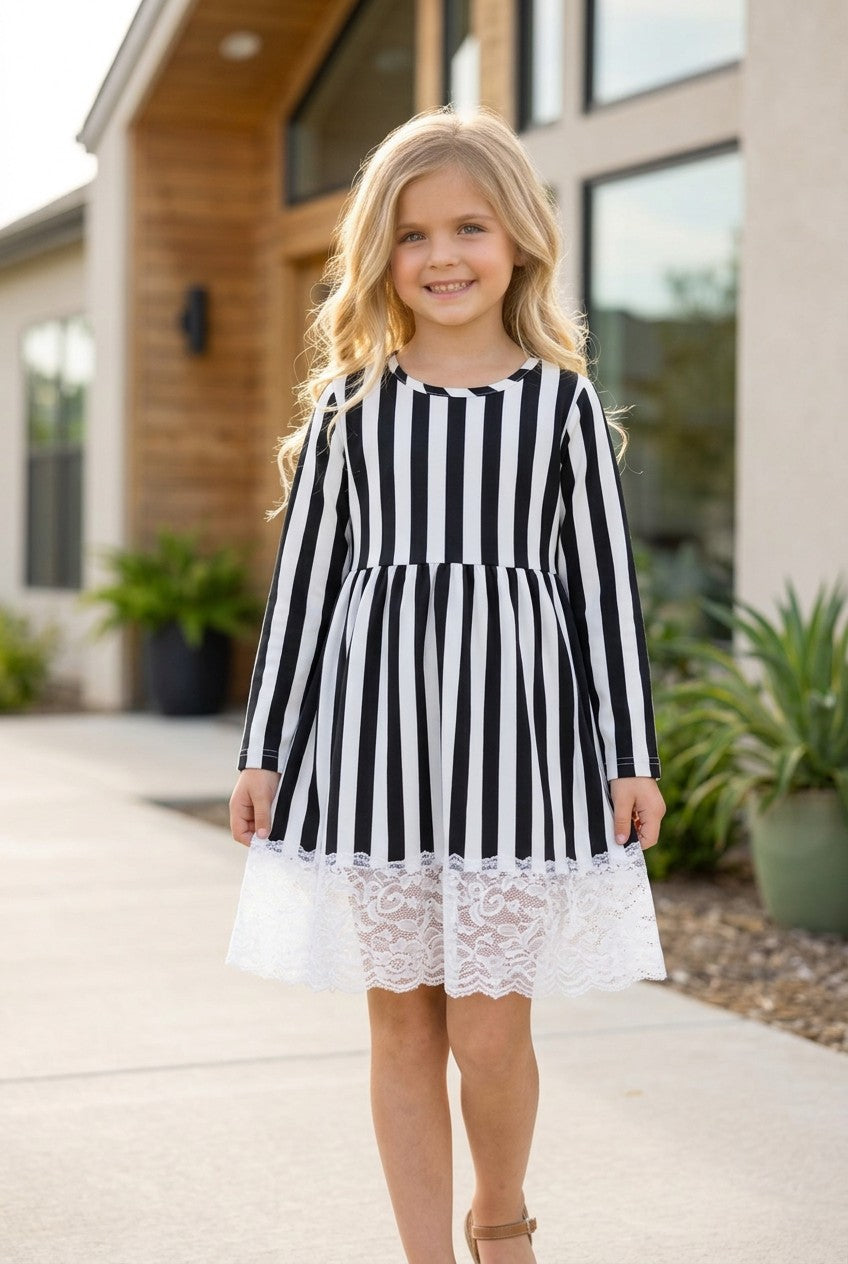 Black & white stripe dress with lace detail.