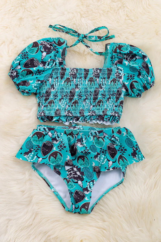 Shield printed bathing set with smocked design and bubble sleeve.