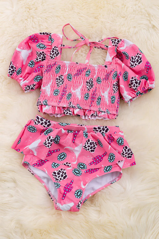 Bubble pink smocked bathing set with western print.