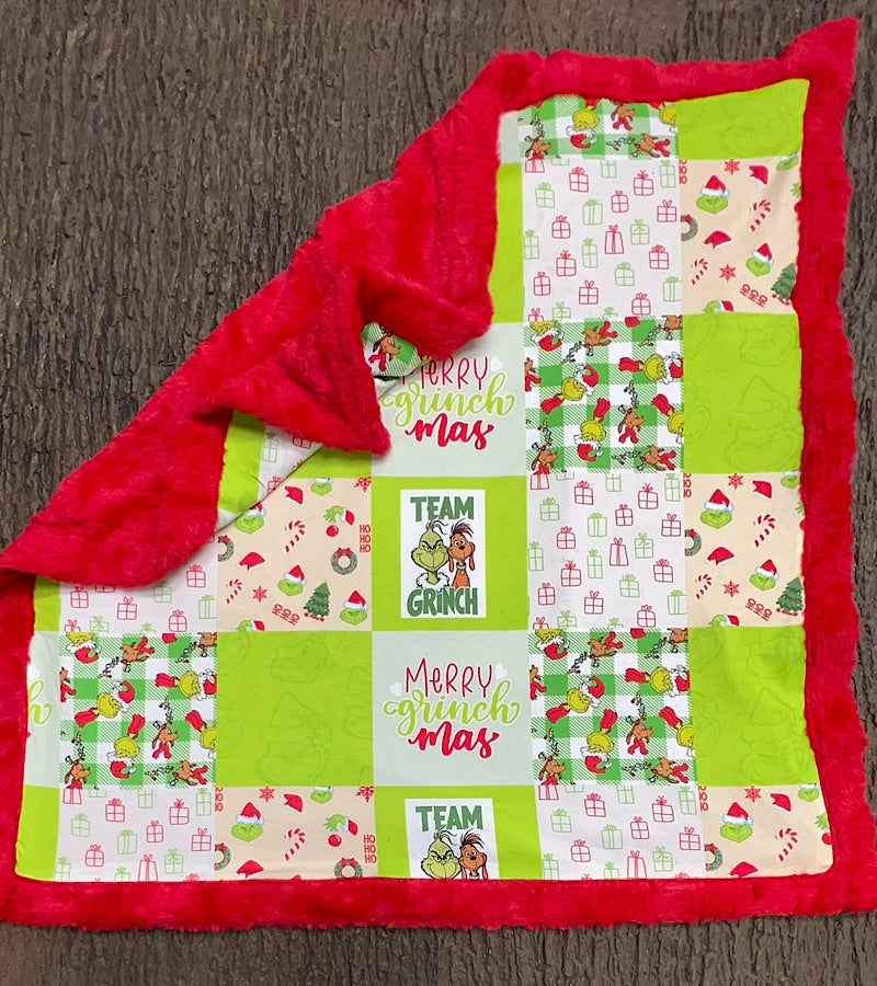 32 inch X 32 inch Green & red Christmas printed baby blanket.