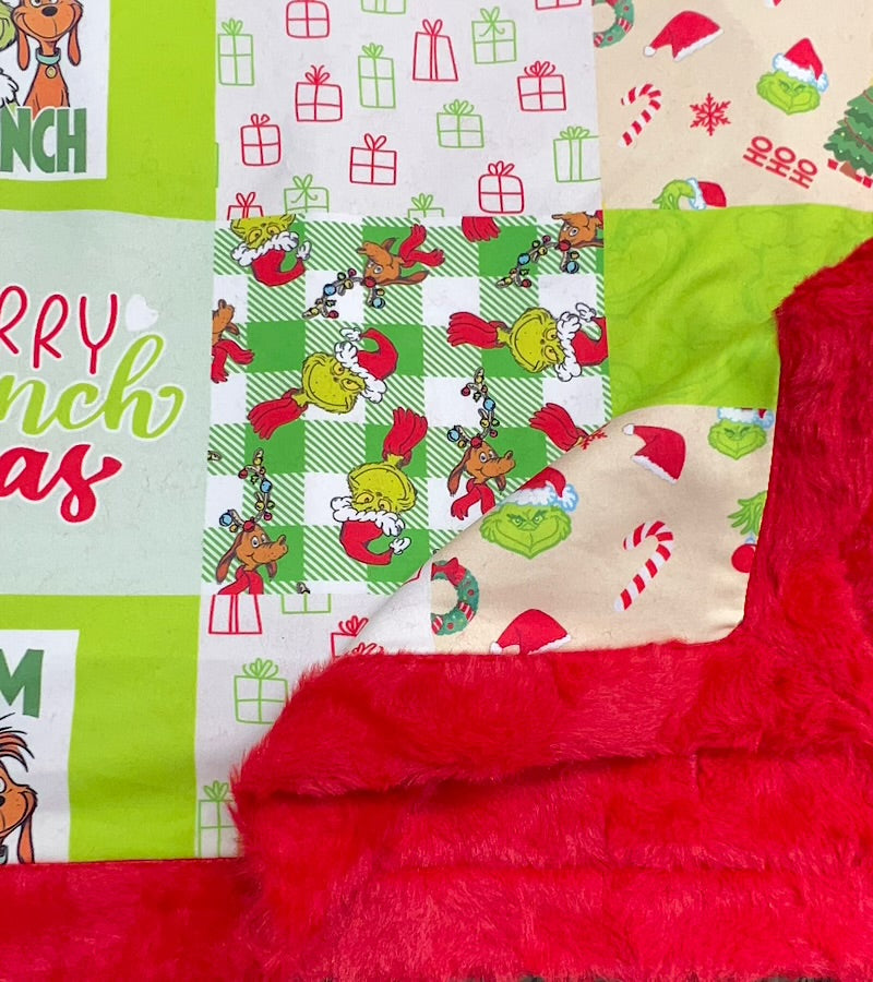 32 inch X 32 inch Green & red Christmas printed baby blanket.