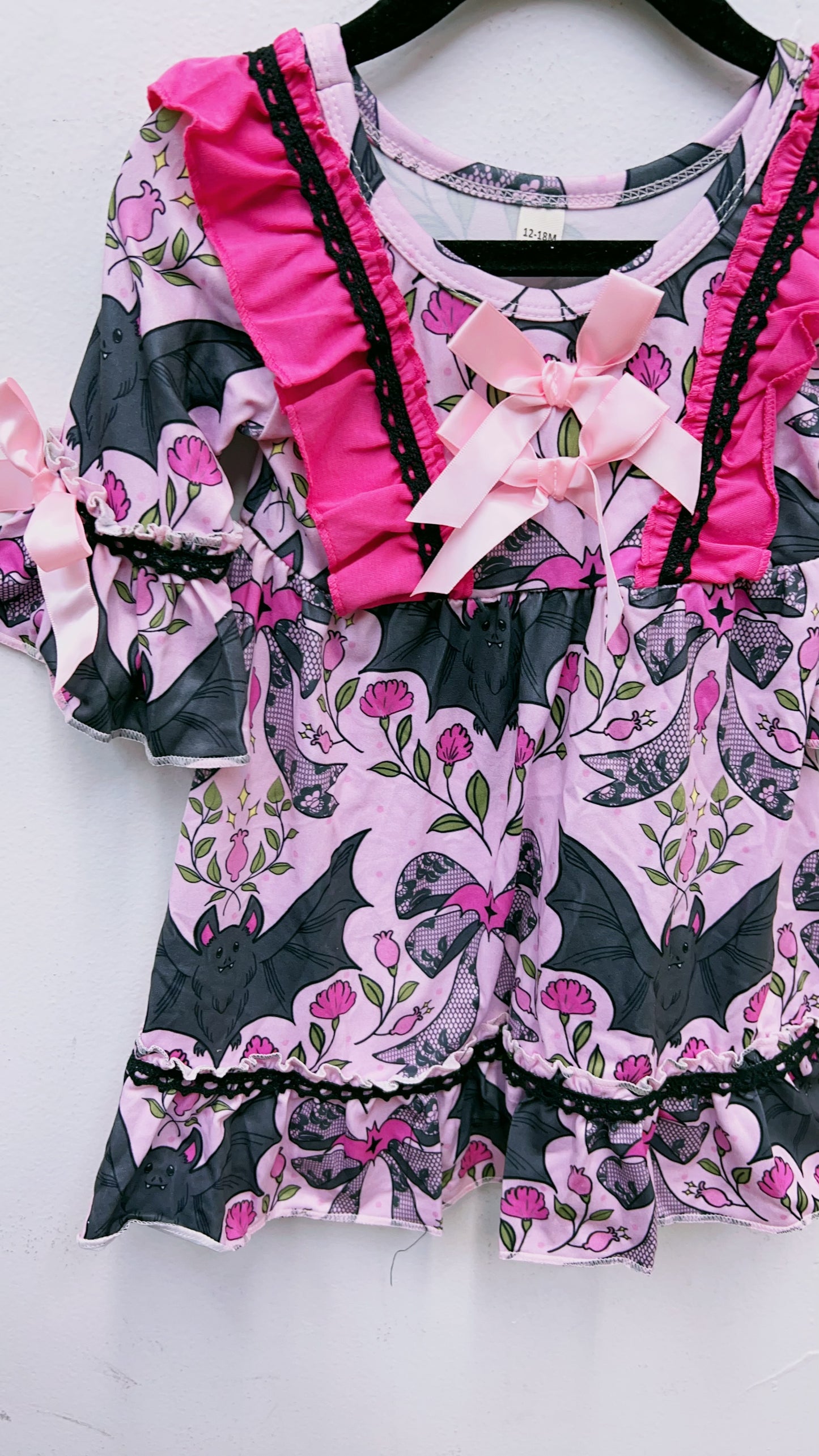 Bat multi printed girls ruffle hem dress.