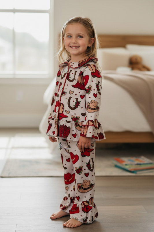Valentines/western printed girls pajamas with ruffle hem.