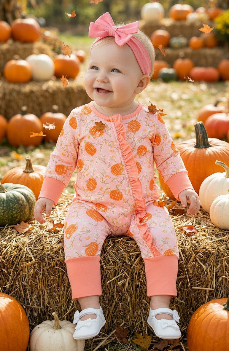 Pumpkin printed on pink baby romper with ruffle trim. RPG62349 -S-