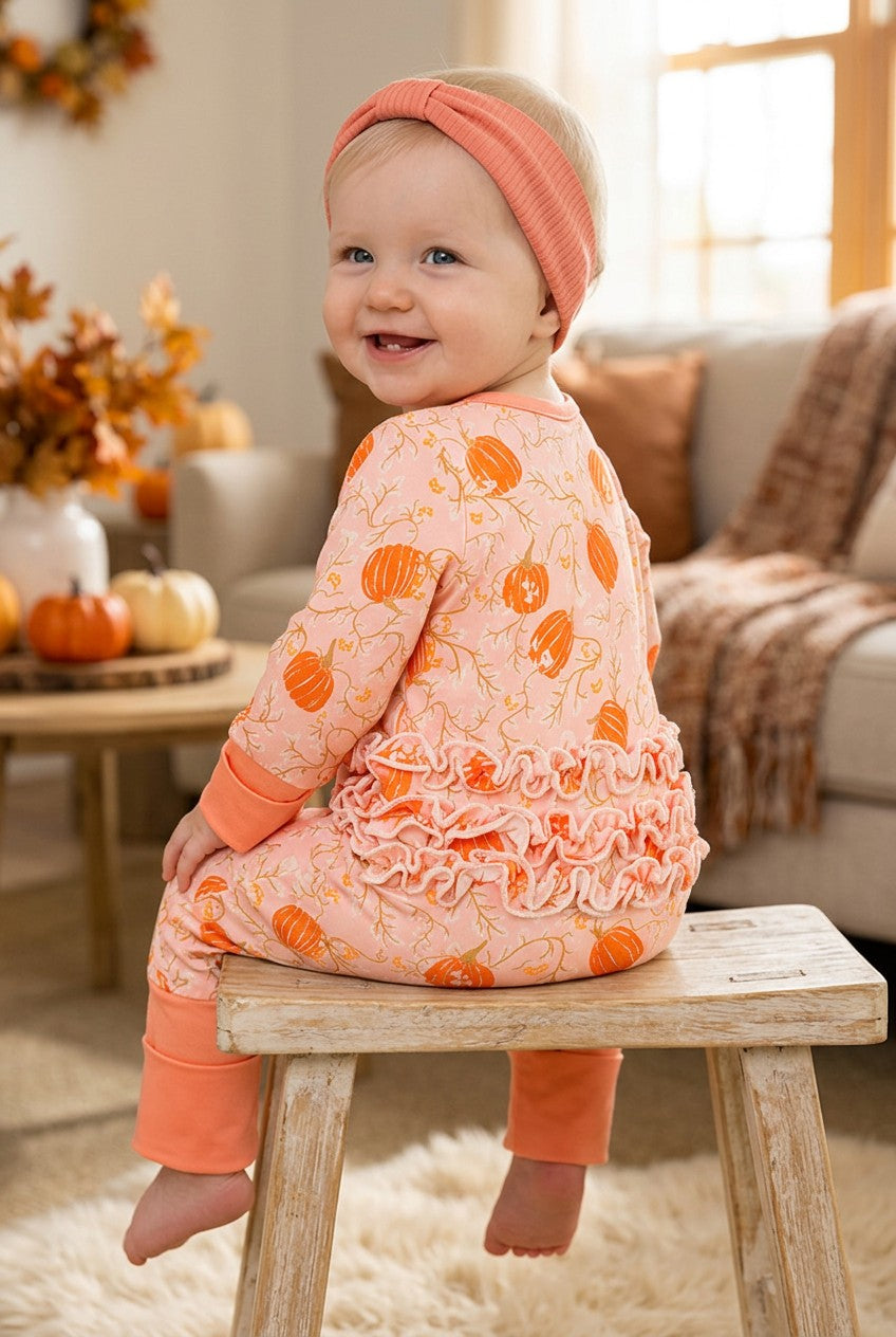 Pumpkin printed on pink baby romper with ruffle trim. RPG62349 -S-