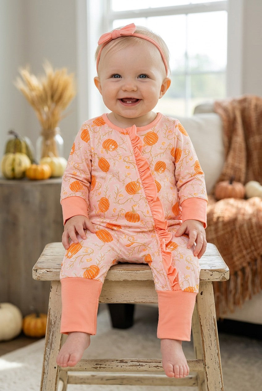 Pumpkin printed on pink baby romper with ruffle trim. RPG62349 -S-