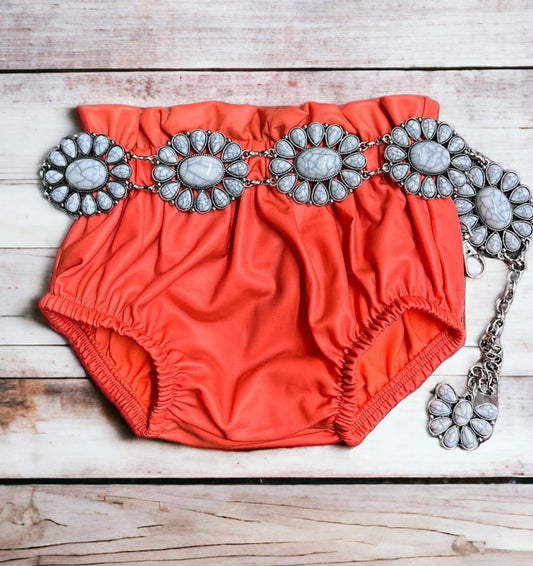 CORAL RUFFLE HEM BABY BLOOMERS. PNG25153120