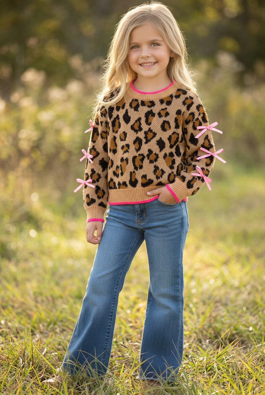 Leopard printed pullover sweater with fuchsia trim and lt. pink bows on sleeves. TPG60423
