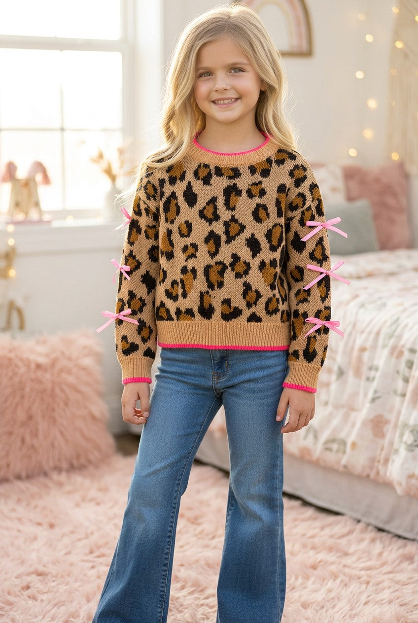 Leopard printed pullover sweater with fuchsia trim and lt. pink bows on sleeves. TPG60423