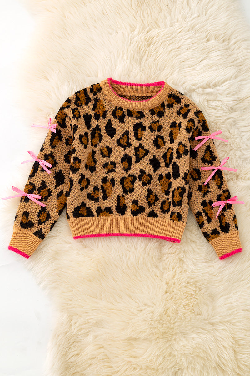Leopard printed pullover sweater with fuchsia trim and lt. pink bows on sleeves. TPG60423