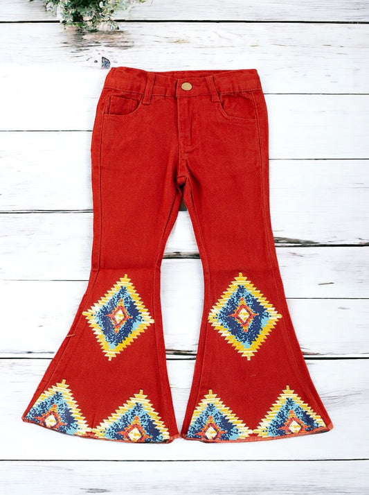 AZTEC ON BURNT ORANGE PRINTED DENIM PANTS FOR GIRLS. PNG65153060