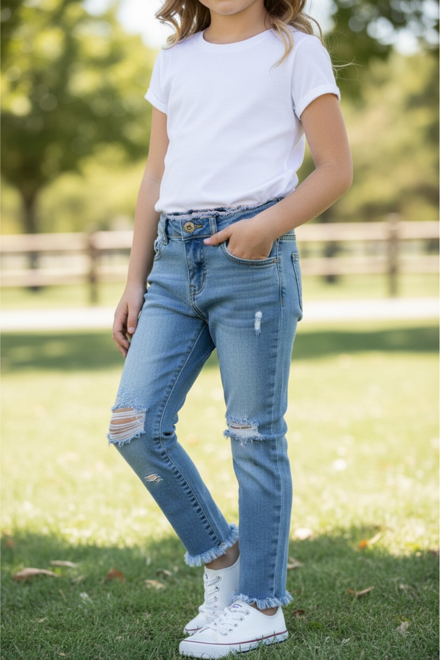 Distressed hem skinny jeans.